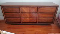 Front view of nine-drawer dresser