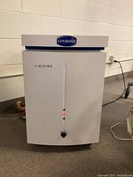 Front view of Epurair HEPA air purifier showing control knob and indicator lights.