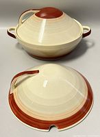 Two covered bowls, one large and one smaller with domed lids, showing beige to reddish-brown gradients and handles on lids and bowls