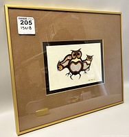 Full view of framed print showing the gold frame and brown matte surrounding the owl print artwork.