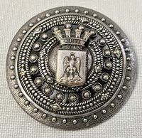 Top view of the sterling silver brooch featuring detailed Venice city crest and eagle emblem on the front side with textured patterns.