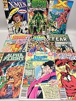 Photo showing Classic X-Men, Green Lantern, X-Factor, Squadron Supreme, The New Teen Titans, The Haunt of Fear, Alpha Flight, Legion of Super-Heroes Annual, Firestorm comics.