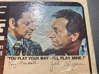 Close-up of the Challenge Yahtzee box lid with autographs and the phrase 'You play your way - I'll play mine!'