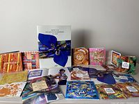 Full lot spread including twenty Hermes printed catalogues and instruction booklet.