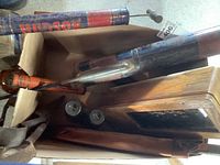 Vintage bug sprayers including Hudson and Spra-well sprayers, old locks, and wooden box visible