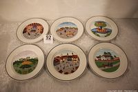 Set of six Villeroy and Boch Laplau decorative porcelain plates arranged in two rows showcasing the unique country scenes on each plate.