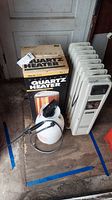 Full view of all items: Welbilt oil heater, Marvin 2020 quartz heater box, and plastic sprayer.