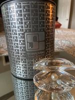 Swarovski Silver Crystal original cylindrical box with clam shell figurine in front