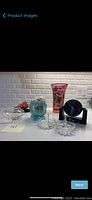 Overview photo showing all items including large pink vase, small turquoise vase, decorative tulip rose, small glass dish, ring holders, E Trends clock, and globe music box.