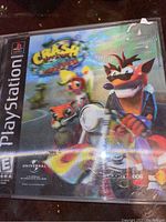 Photo of the front cover of the Crash Bandicoot Warped PlayStation One game showing the disc case and cover art with minor wear.