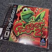 Clear photo of the Frogger 2 Swampy's Revenge game case with cover art visible.