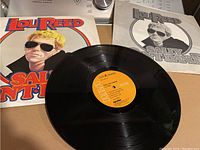 Photo showing Lou Reed Sally Can't Dance vinyl record with album cover and inner sleeve.