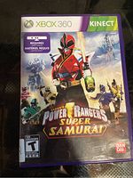 Front cover of Xbox 360 Kinect game Power Rangers Super Samurai, displaying game title, ESRB rating, Kinect requirement, and cover art.