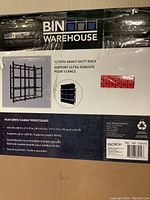 Front label on the boxed shelving unit showing product image and specs.