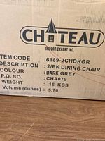 Cardboard box packaging showing brand Chateau, item code 6189-2CHDKGR, description 2/PK Dining Chair, color Dark Grey, weight 16 kgs.