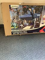 Front of sealed box showing Wild Sports corn hole set imagery and branding