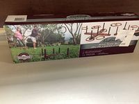 Photo of the unopened Eastpoint solid wood ring toss set box on a flat surface showing game in use and packaging front.