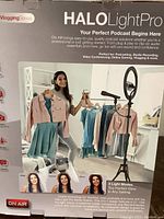 Full box front view showing branding, product name, and marketing images of the Halo Light Pro setup with microphone and ring light.