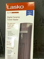 Photo of the heater box front showing brand, product name, and features.