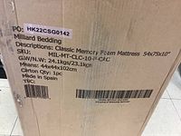 Cardboard shipping box front showing PO number, brand name, product description, SKU, gross/net weight, carton quantity, and origin.