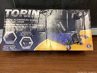 Box of Torin 3 ton aluminum steel service jack showing brand and specifications.
