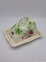 Butter dish assembled view showing the decorated cover sitting on the base plate