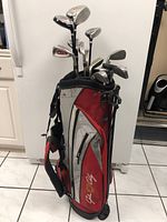 Full view of golf bag standing, with 14 clubs inserted