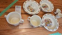 Top-down view of two ceramic mugs and two egg holders showing the design and size
