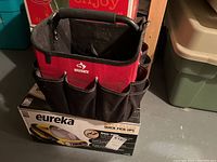 Photo of Husky tool carrier tote sitting on the sealed Eureka vacuum box