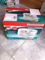 Original box of Honeywell Cool Moisture Humidifier showing product image and features.