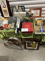 Full overview of items including organizers, frames, puzzle box, Mr and Mrs sign, and other miscellaneous household items displayed on green cloth.