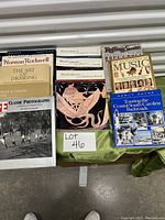 Photo showing multiple books laid out: classic photographs, Norman Rockwell drawing, Paul Getty Museum Masterpieces, music encyclopedias, and a travel guide to Coastal South Carolina.