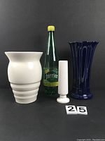 Photo showing three vases and a Perrier bottle for size reference