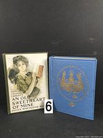 Two hardcover books side by side; 'An Old Sweetheart of Mine' with illustrated dust jacket, 'Quality Street' with blue cover and gold embossing.