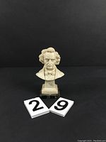 Front view of Berlioz bust on marble base with lot numbers 29