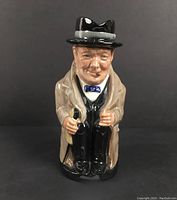 Front view of the Royal Doulton Winston Churchill Toby character mug, showing detailed facial features, coat, and hat.