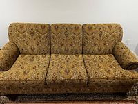 Front view of the Barrymore paisley fabric sofa showing the three seat cushions and back cushions with rolled arms.