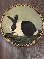 Front view of Lenox collectible plate showing black and white bunny with checkered rim.