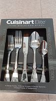 Full box front showing the Cuisinart Elite logo, French Rooster Collection, and the 20 piece cutlery contents for 4 people.