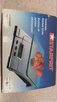 Box showing Starfrit branded electronic kitchen scale with digital display and strawberries on platform image.