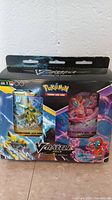 Front view of sealed Pokemon V Battle Deck box showing Zeraora and Deoxys card images and artwork.