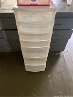 Large white storage unit with 7 drawers, translucent plastic, on wheels