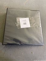 Black binder used to store the Pokémon card collection