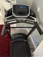 Top view of the treadmill display console and handles showing the main control interface and condition of the treadmill.