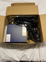 Yihua soldering station with soldering iron and hot air handle in cardboard box, cables visible
