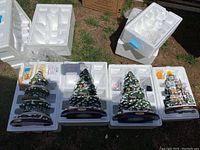 Four tiered Christmas tree music boxes and styrofoam packaging
