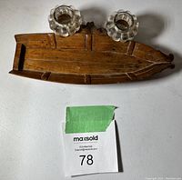 Top view of the wooden boat shaped ink well with two glass ink wells and pen slot.