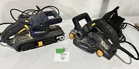 View of Mastercraft belt sander (left) and planer (right) showing overall condition and corded power supply.