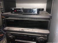 Rack showing Bell 4K box, Paradigm X-300 amplifier, Denon receiver