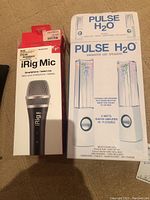 Pulse H2O and iRig Mic boxes shown together with microphone partially removed from box.